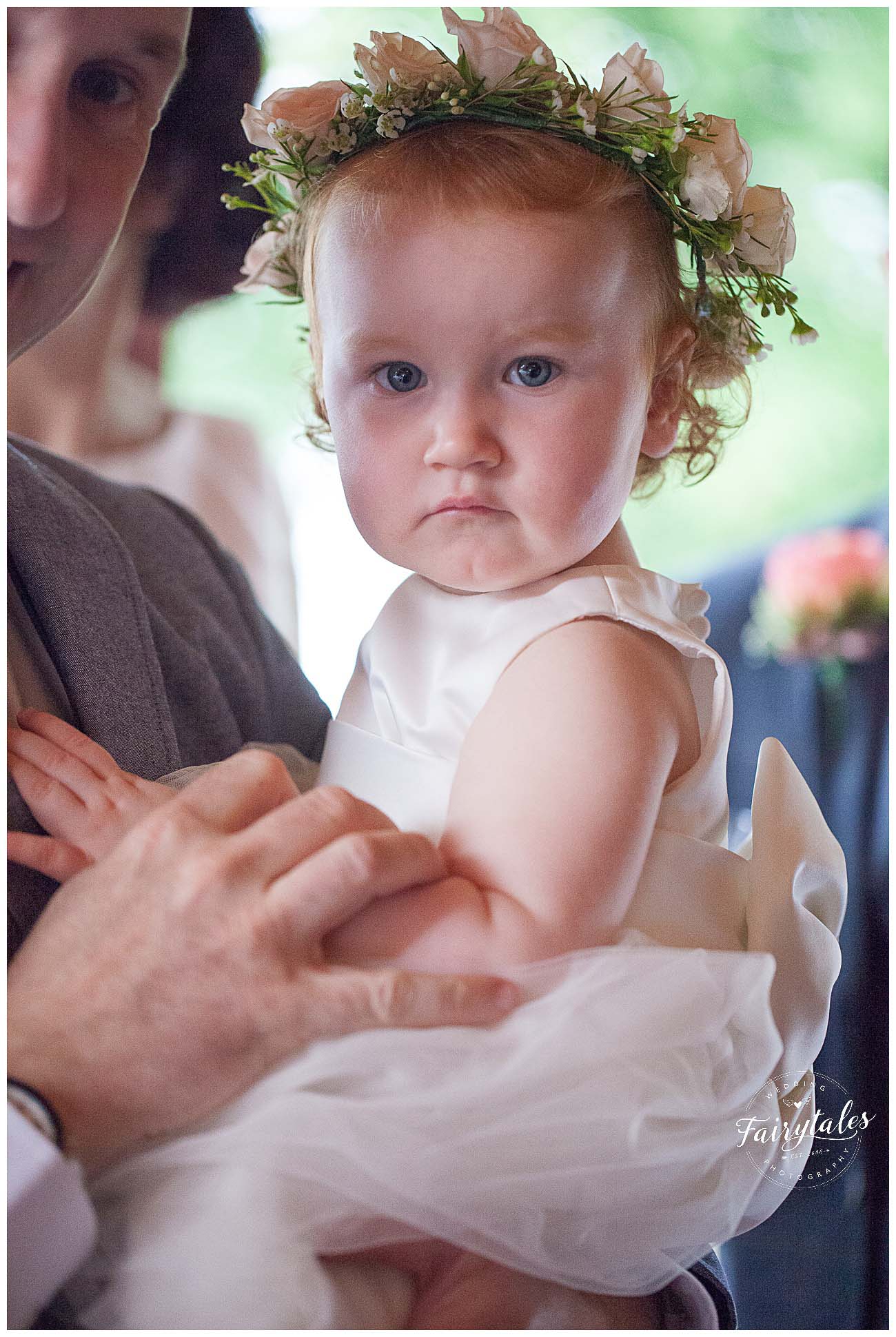 Flower girl at the cruin looking grumpy