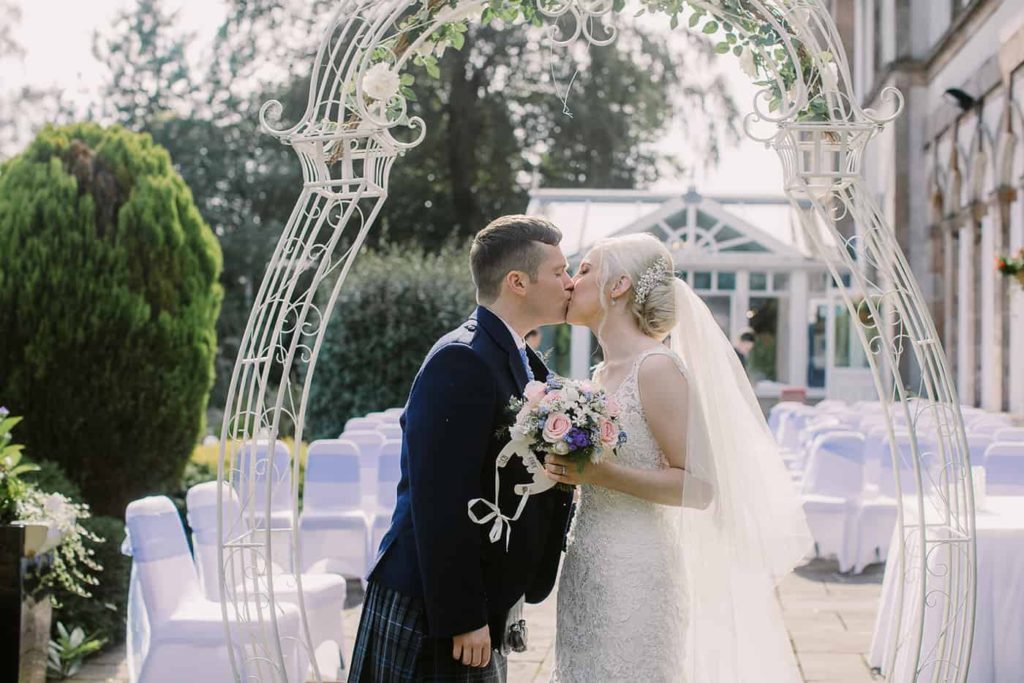 Bride and groom kissing at rosslea hall 
